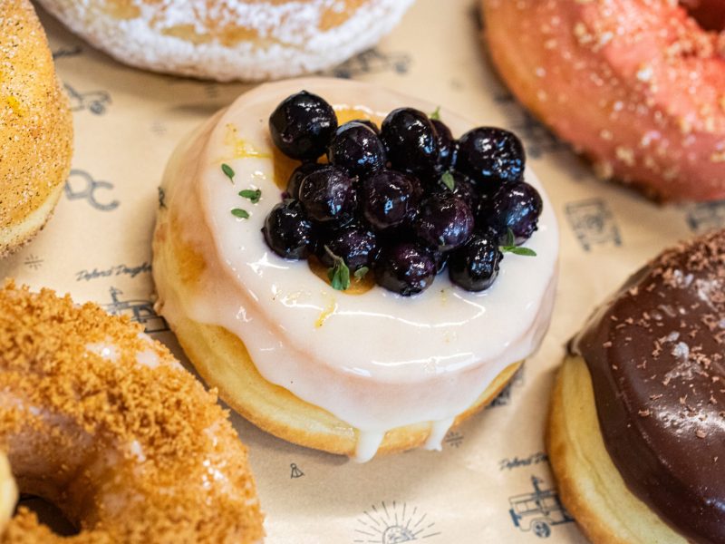 Mascarpone glazed doughnut with blueberries and a cream cheese center from Handcraft Doughnuts