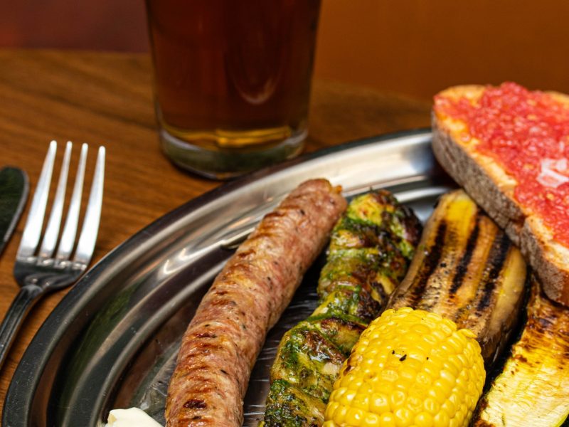 Grilled sausage, vegetables, and pan con tomate at Brasa inside The Square